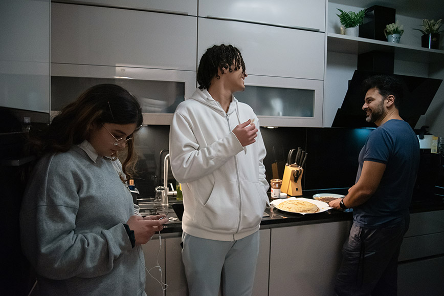 Family manager Rahman making dinner for his family