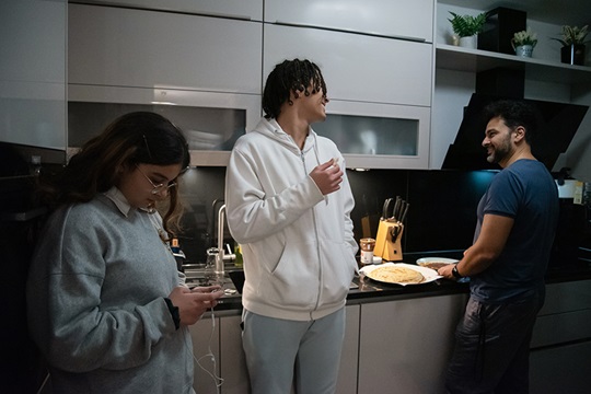 Family manager Rahman making dinner for his family