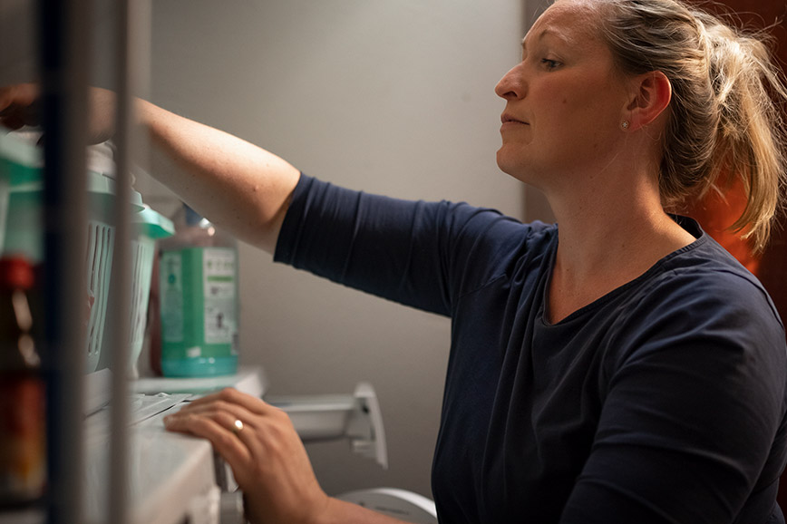 Family manager Regina doing her family’s laundry