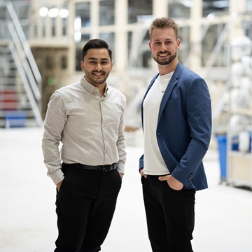Two employees standing together