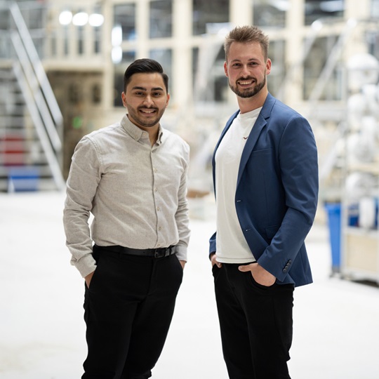 Two employees standing together