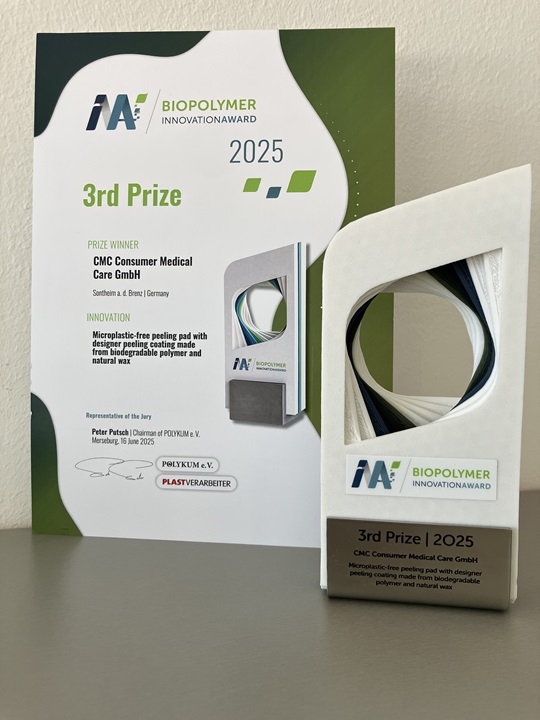 Award certificate and trophy for CMC Consumer Medical Care GmbH's 3rd Prize at the 2025 Biopolymer Innovation Award for a microplastic-free peeling pad.