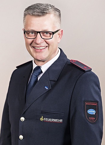 Portrait shot of Pawel Wojcik in his uniform.